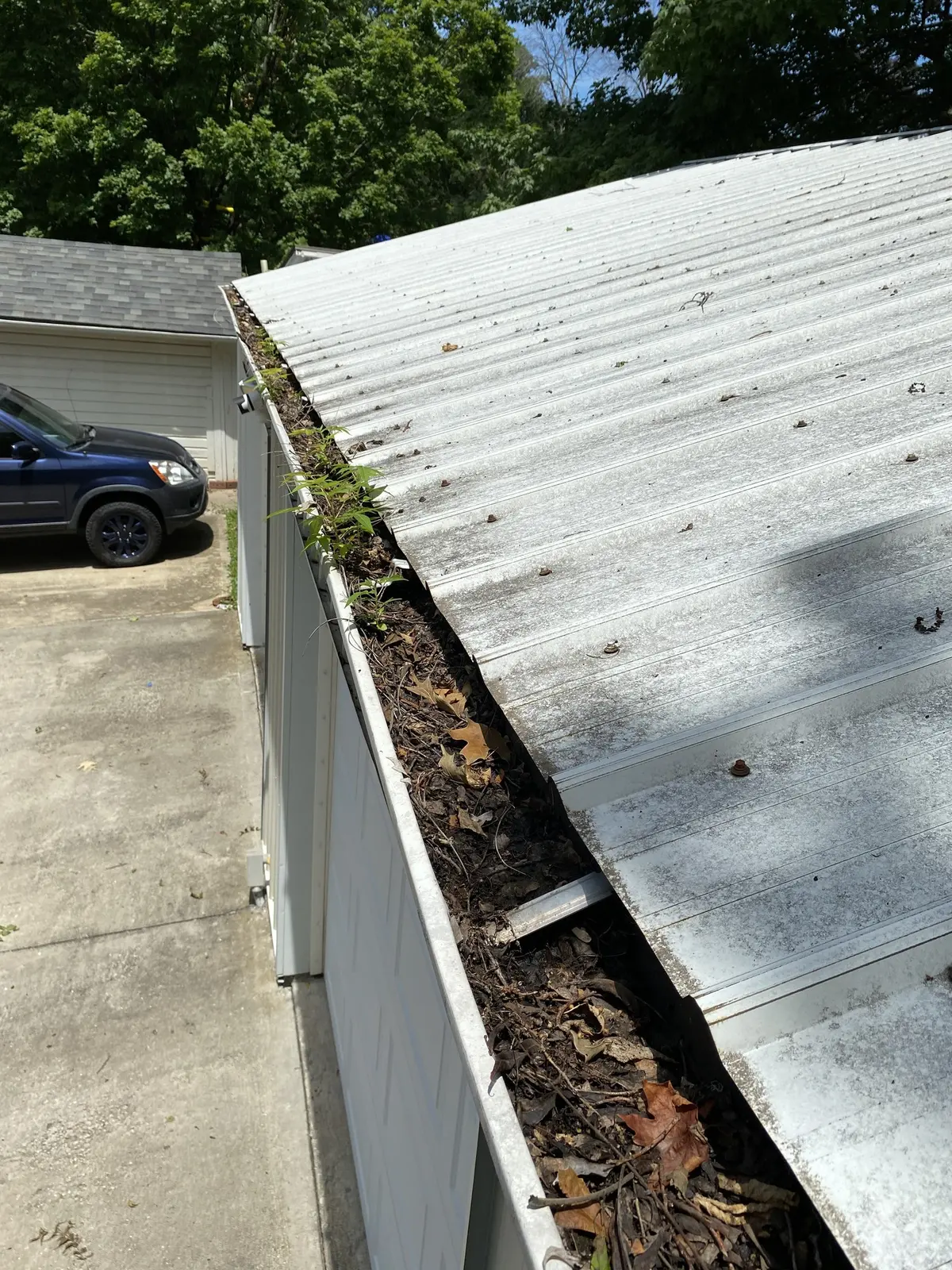 Garage gutter cleaning before cleaning
