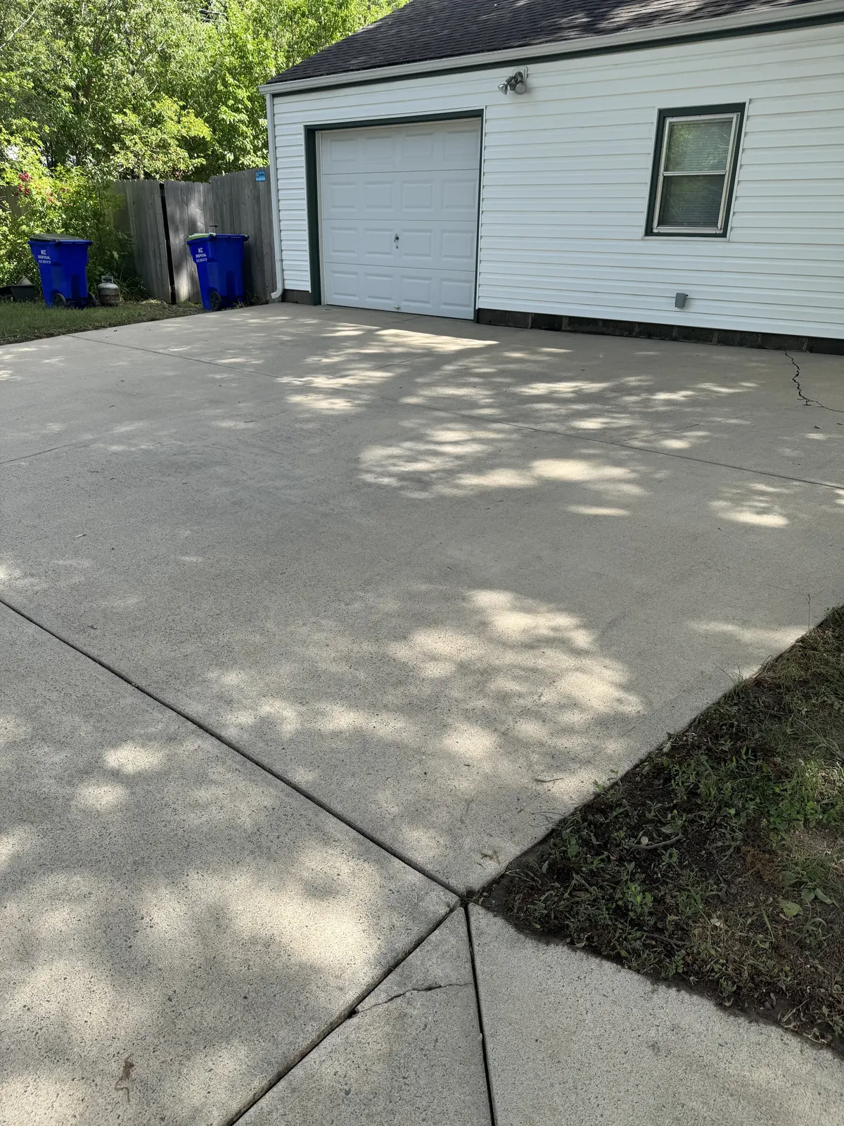 Clean residential driveway after concrete cleaning